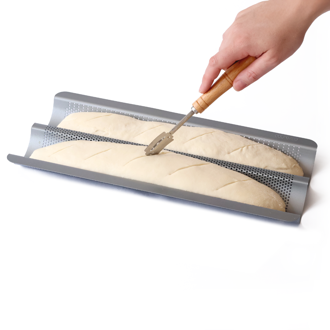 Baguette tray with shaped dough ready to bake